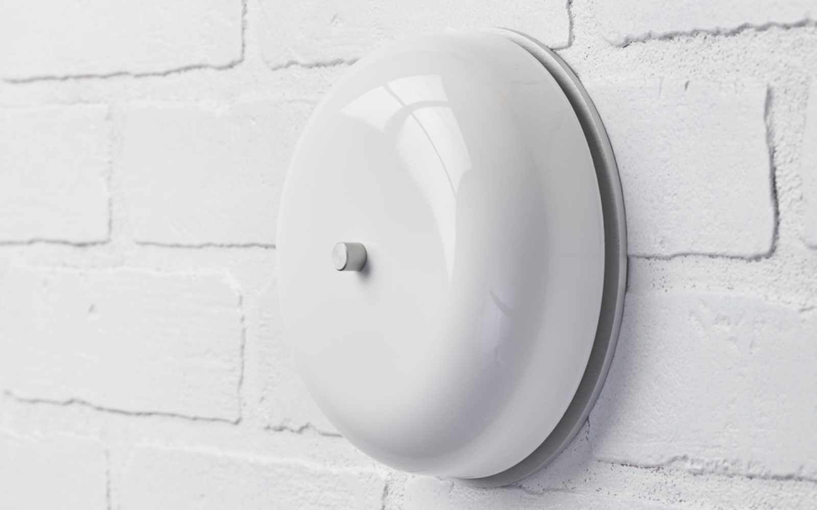 Image of 6 inch all-metal firebell-style doorbell chime with a white powdercoat finish. Stainless steel hardware.